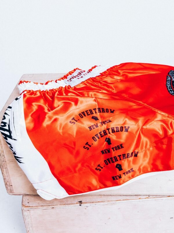 detail of red overthrow boxing shorts